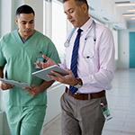 Male-doctor-and-nurse-using-digital-tablet_Thumbnail